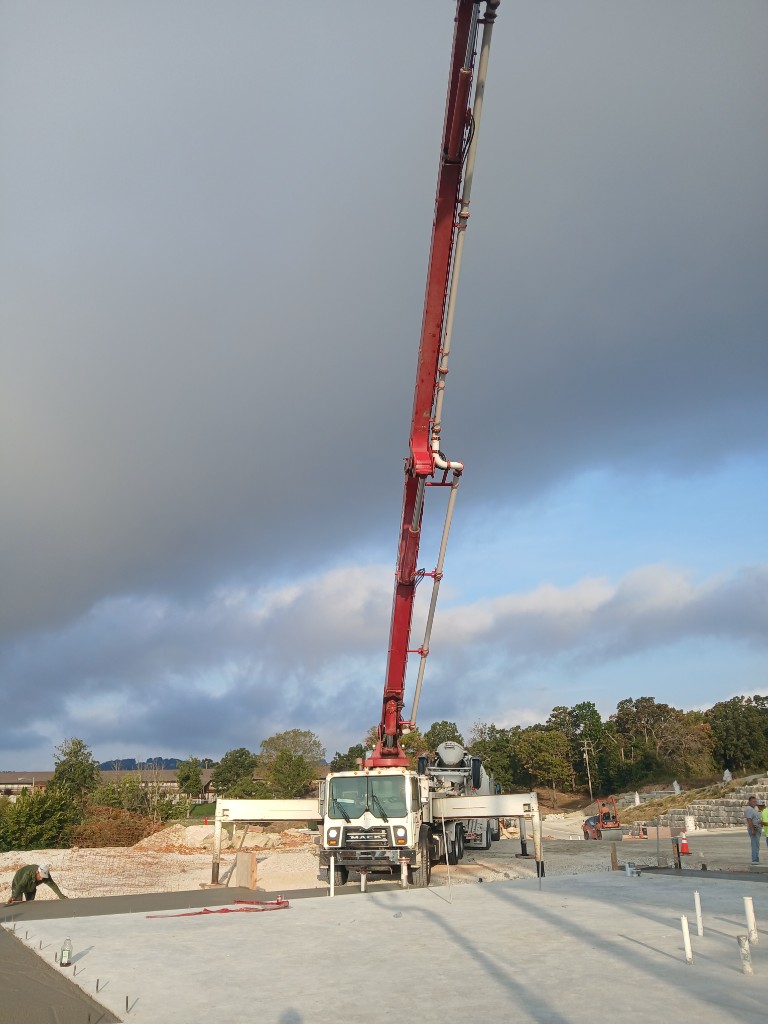 CL Concrete Pumping boom at dusk